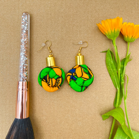 Green African print knotted hook earrings
