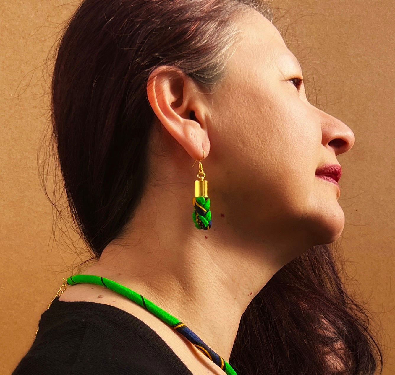 Green African print braided hook earrings.